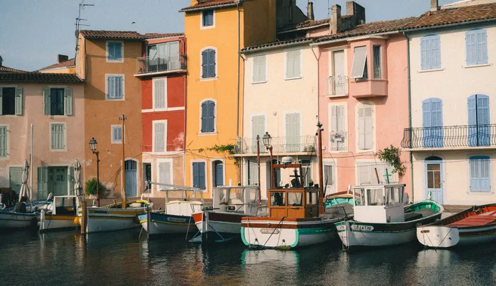 Colourful houses and boats along a canal in the Île district of Martigues